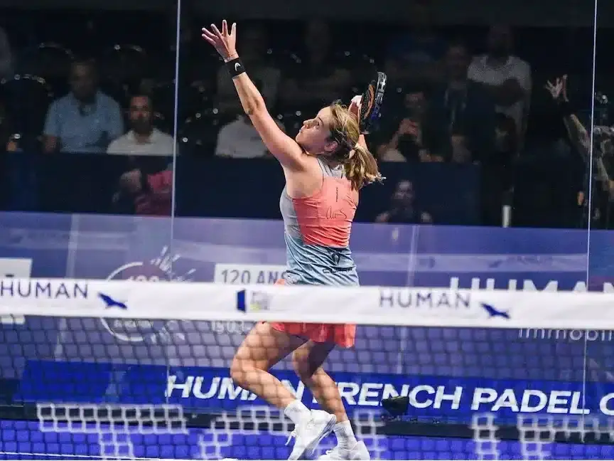 Player hitting a bandeja overhead in padel